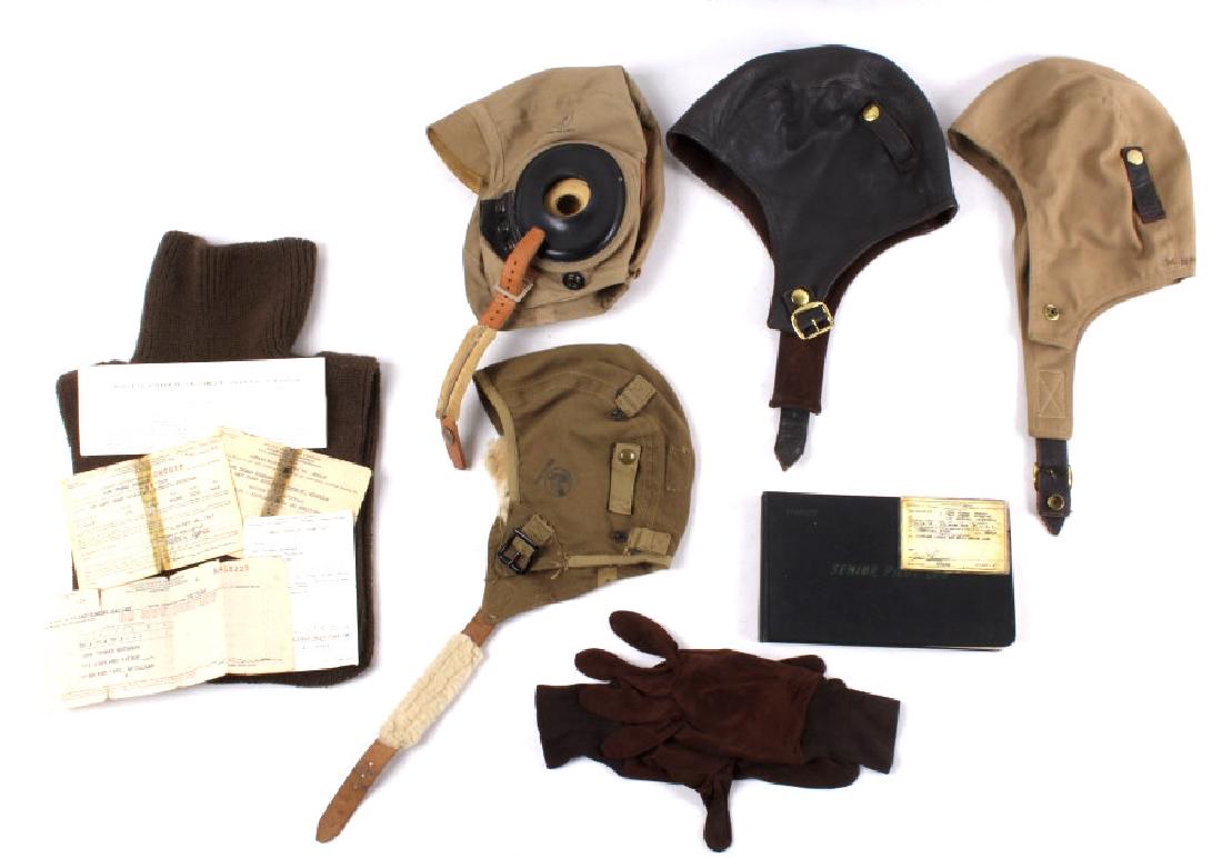 WWII Pilots Flight Gear & Licensing Paperwork: This unique collection of flight gear and licensing paperwork, The flight gear and paperwork are those of a WWII pilot from and after the war. The log book has a detail of all of the flights done from