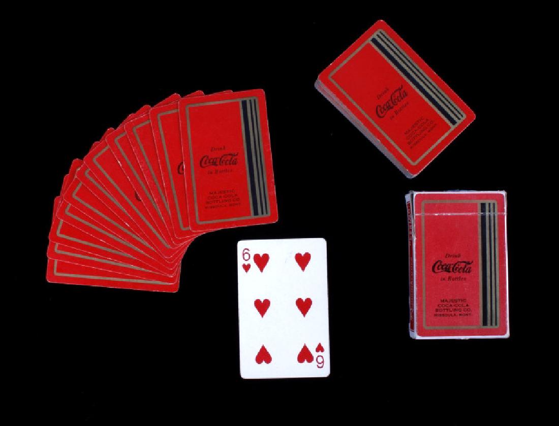 Missoula Coca-Cola Playing Cards Circa 1934: This lot features a deck of Missoula Coca-Cola playing cards dating to 1934. The set are cards given away by the Missoula Coca Cola branch for advertising. The overall condition is good for its age. M