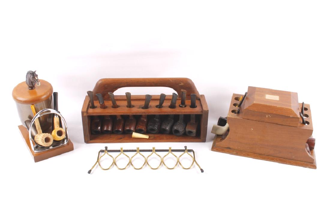 Assorted Tobacco Pipes, Stands, & Humidors: For sale is a bulk collection of tobacco pipes, and pipe stand/tobacco humidors. The first stand being a "Seateak" teak wood 9 pipe stand in good condition. This is the largest piece of the group meas