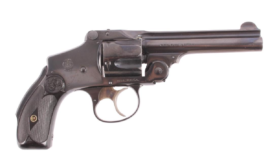 Smith & Wesson Safety Hammerless .38 DA Revolver: This is a Smith & Wesson Safety Hammerless Fifth Model "Lemon Squeezer" double action revolver chambered in the .38 caliber. The revolver features a blued steel barrel, frame and 5-shot cylinder with