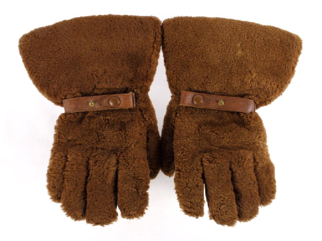 Cowboy Buffalo Hide Hunting Gauntlets: This is a pair of cowboy buffalo hide leather hunting gauntlets. They show a wonderful buffalo hide exterior with curly buffalo fur. The inside of the gloves are lined with the same buffalo fur. Insid