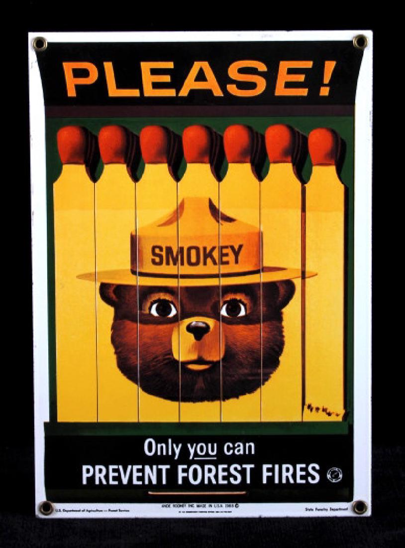 Smokey Bear U.S. Forest Service Porcelain Sign: This is a Smokey Bear porcelain enamel sign. Smokey Bear was adopted by the U.S. Forest Service back in the 1940's as part of their campaign to prevent forest fires. This sign shows a book of matches