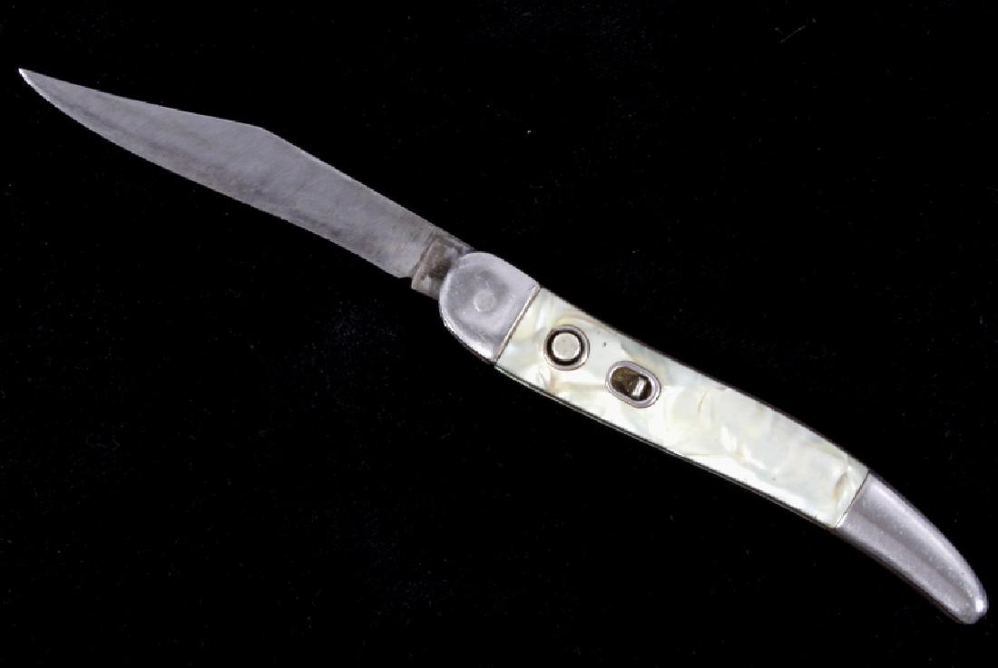 Hammer Brand Mother of Pearl Switchblade c.1950's: Offered for sale is a Hammer Brand switchblade. The knife dates to the 1945-1955. The grips are mother of pearl. The knife is fully functional, but look to need oiling. This is an excellent early orig