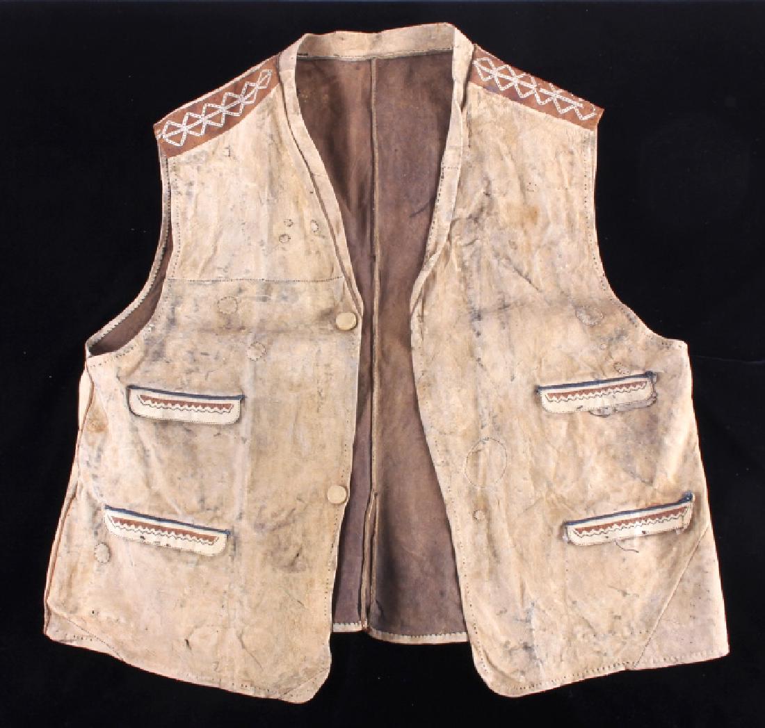 Eskimo Tanned Hide Vest 19th Century: This is an excellent Eskimo Northwest Coast Native American Indian vest attributed to the 19th Century. The vest shows an Indian tanned hide construction with unique art appeal fringed shoulders and p