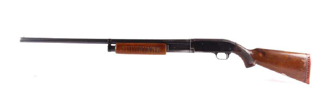 J.C. Higgins Model 20 12 Gauge Pump Action Shotgun: This is a J.C. Higgins (Sears Roebuck & Co.) Model 20 pump action shotgun chambered in the 12 gauge. The shotgun features a blued steel barrel and receiver with solid walnut hardwood stocks. The left