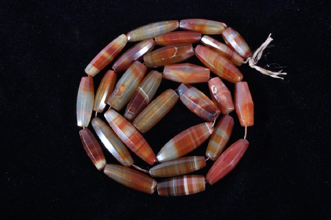Rare Carnelian Agate Gemstone Necklace: You are bidding on a collection of Rare Carnelian Agate Gemstones strung as a necklace. The piece features twenty seven gems. They are beautifully cut and have a great color. The yare in good conditio