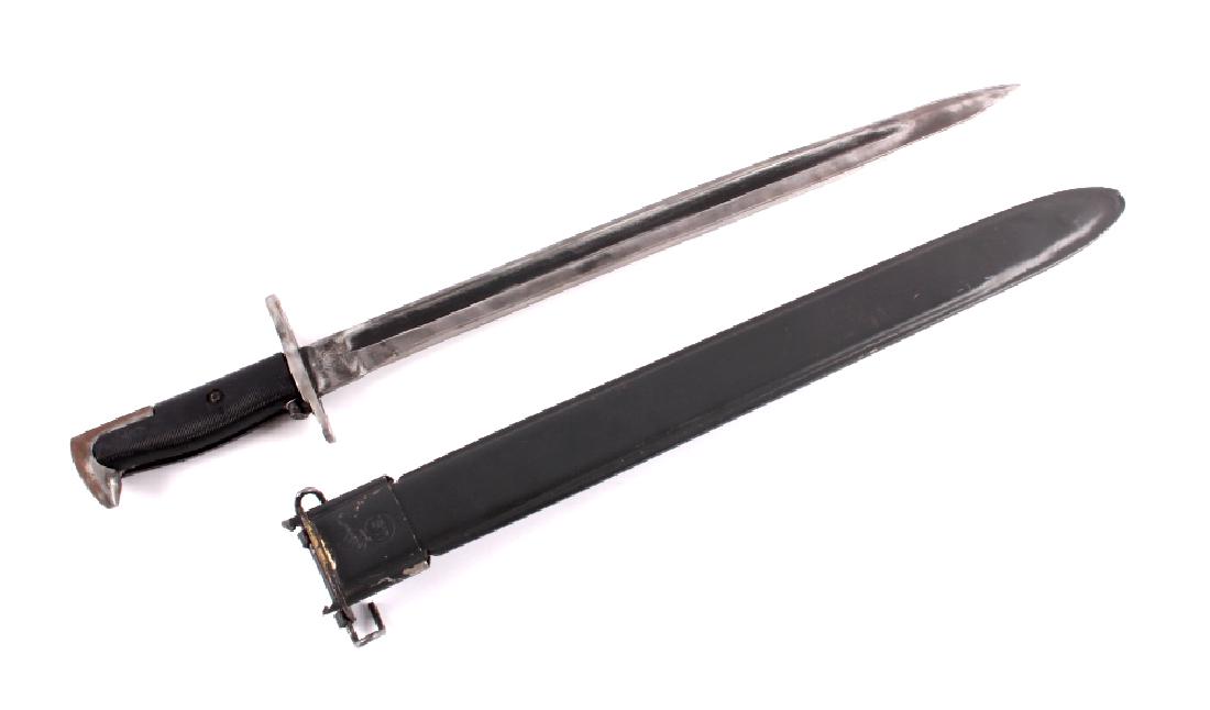 U.S. Marine Corps M1905 1942 M1 Garand Bayonet: This is a RARE WWII U.S. Marine Corps M1905 1942 M1 Garand bayonet and scabbard. The ricasso is marked "U.S.M.C. US 1942" with a flaming bomb on one side and the other side is marked with the image of