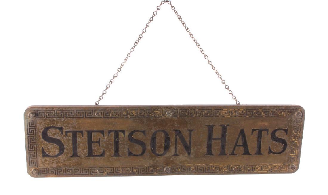 Original Stetson Hats Advertising Sign Circa 1900: This is an early original Stetson hats advertising sign from circa 1900. The sign is made from brass with a wooden frame backing. The front of the sign has a decorative border with lettering that read