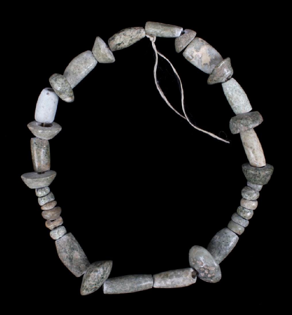 Pre-Columbian Jade Bead Necklace: Offered in this lot is a Pre-Columbian Jade bead Necklace. Jade was considered a rare and valued commodity among pre-Columbian Mesoamerican cultures, such as the Olmec, the Maya, and other various gro