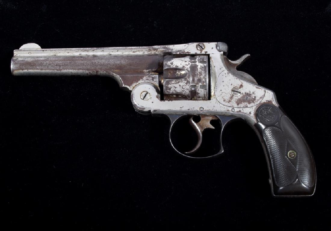 Smith & Wesson First Model No. 3 Revolver c. 1880: This is an early Smith & Wesson .44 Double Action First Model No. 3 Revolver with original 5 inch ribbed barrel and very low serial number of 14975 from circa 1880’s. The revolver is chambered in th