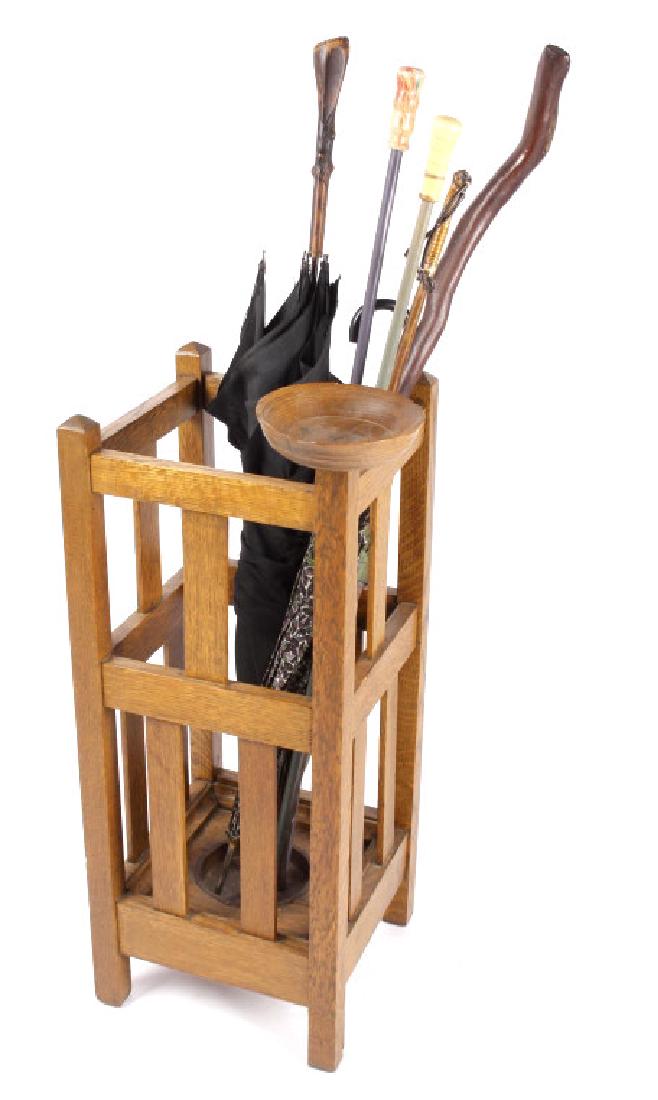 Mission Style Oak Umbrella Stand: This lot provides you the chance to bid on a circa 1900 - 1910 Mission Style, Solid Oak Umbrella or Walking Cane Stand. The base of the stand includes a copper bowl for the umbrellas, while the top of