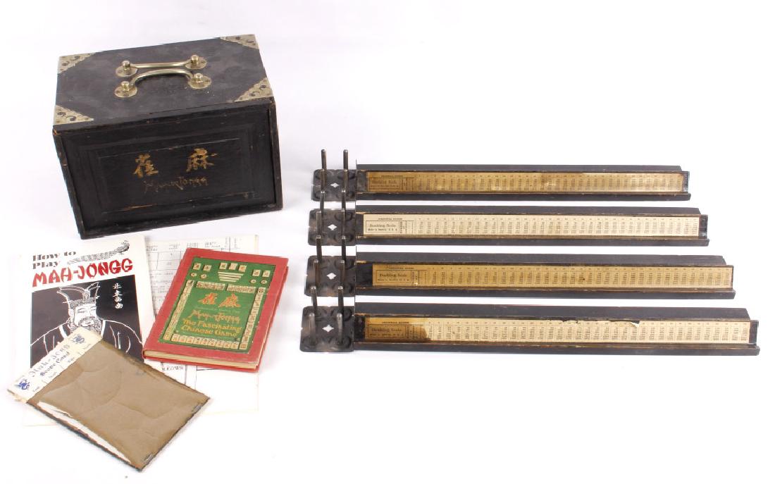 Wooden Mah-Jongg Set Circa 1920's: Available in this lot is a complete Mah-Jongg set, including the original tiles and case, along with four tile racks, multiple instruction manuals and rule books, and a score card. Slide the front cov