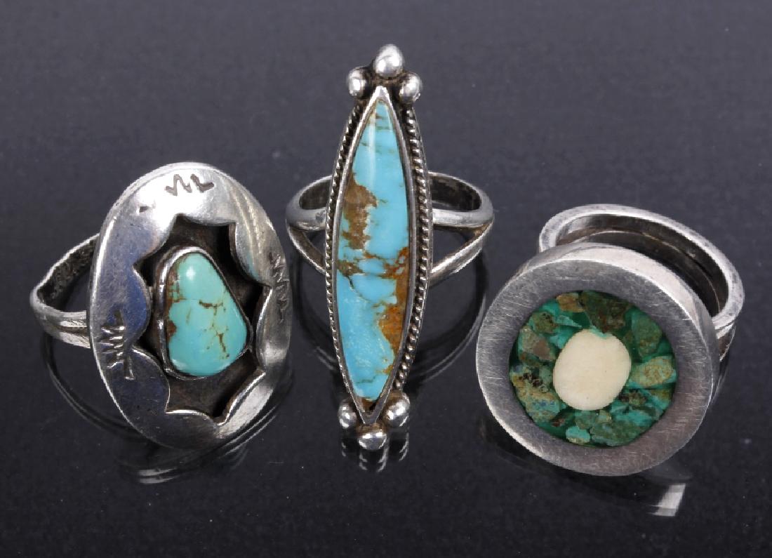 Navajo Sterling Silver & Inlaid Turquoise Rings: Provided for bidding in this lot is a set of three rings, two being Navajo Native American Indian, the third being manufactured in Mexico, with Navajo design characteristics. The two Navajo pieces are