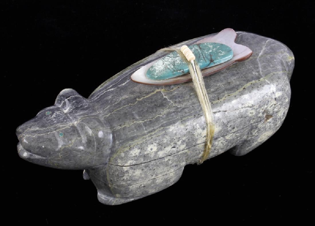 Zuni Native American Bear Fetish Carving: Up for bidding in this lot is a Zuni Native American Indian Bear Fetish Carving. The piece is believed to be carved from a chunk of soapstone or semi-precious mineral. Strung to the back of the bear w