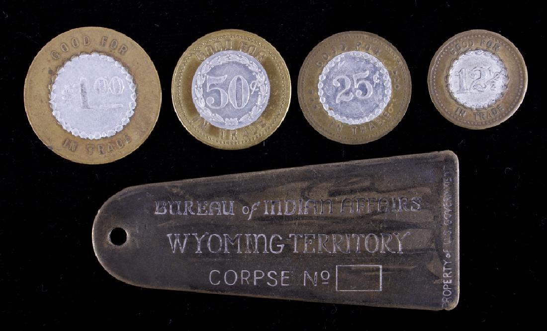 Mint Great Falls MT Trade Tokens & Wyoming Toe-Tag: This lot features a set of four bi-metal cigar store trade tokens from Great Falls, Montana. As well as a "Bureau of Indian Affairs - Wyoming Territory" Brass Toe Tag. Each coin is a different size an