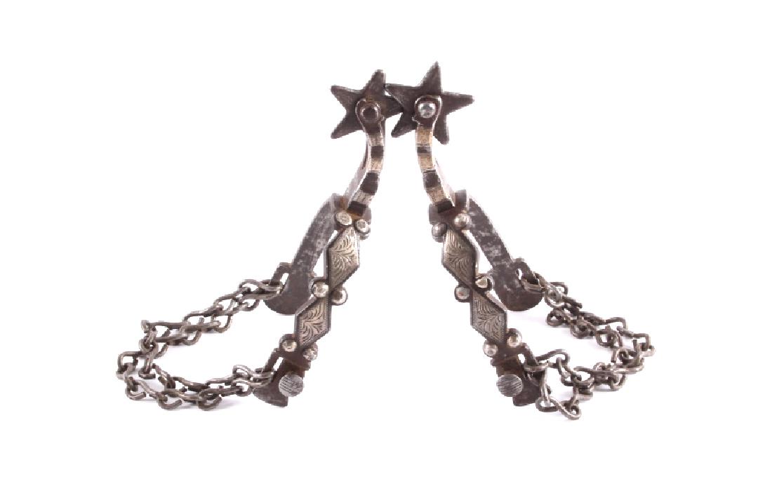 Antique Buermann Silver Mounted Spurs: This is a pair of antique Buermann No. 1 Pattern silver mounted spurs. The spurs are hand forged with silver mounted accents on the outside of the heel band and the drop shank. The spurs are in good c