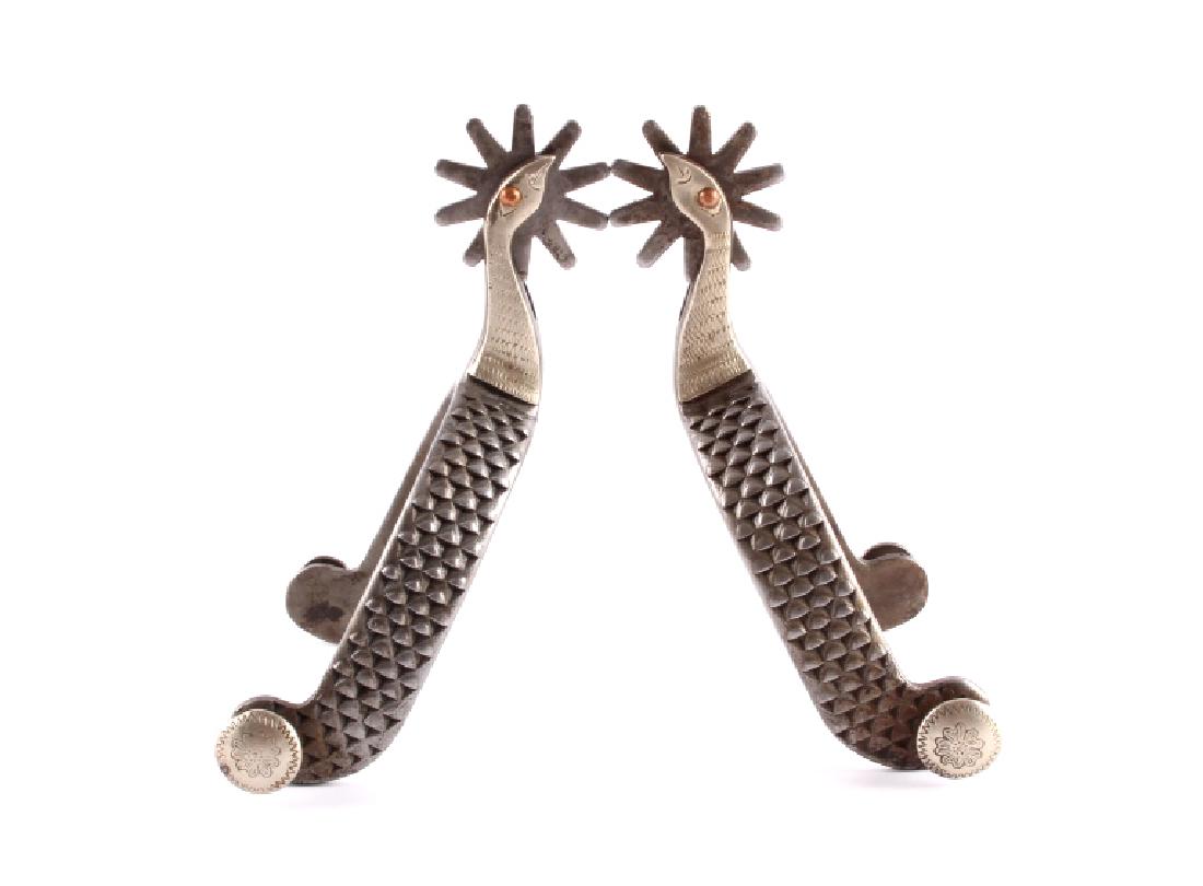Canon City Prison Made Goose Head Spurs: This is a pair of Canon City Prison made goose head spurs from circa 1940. The spurs were forged from hardened steel files and show the figural goose head shank. One side of the shank has a silver mou