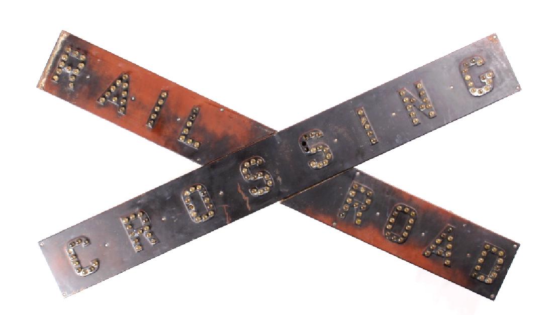 Railroad Crossing Sign Cat-Eye Reflectors c. 1930: This item is a circa 1930's-40's reflective railroad crossing sign. The sign is constructed of heavy gauge steel, and assembled in two crossing pieces. The sign reads "RAILROAD CROSSING" in reflective