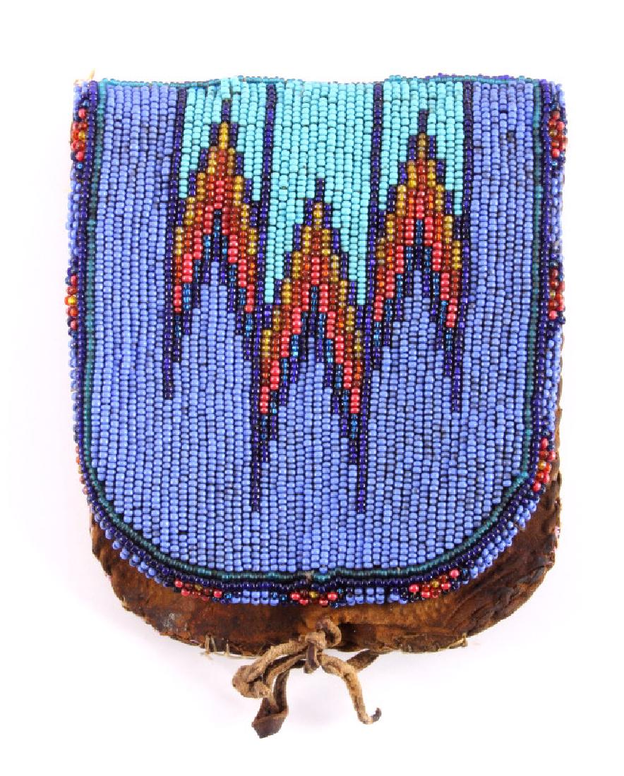 Sioux Native American Beaded Belt Bag c.1890: This is a Sioux Native American Indian beaded belt bag from circa 1890. The bag is made from brain tanned hide with a beautifully beaded design on the front flap. The beadwork is done in glass trade s