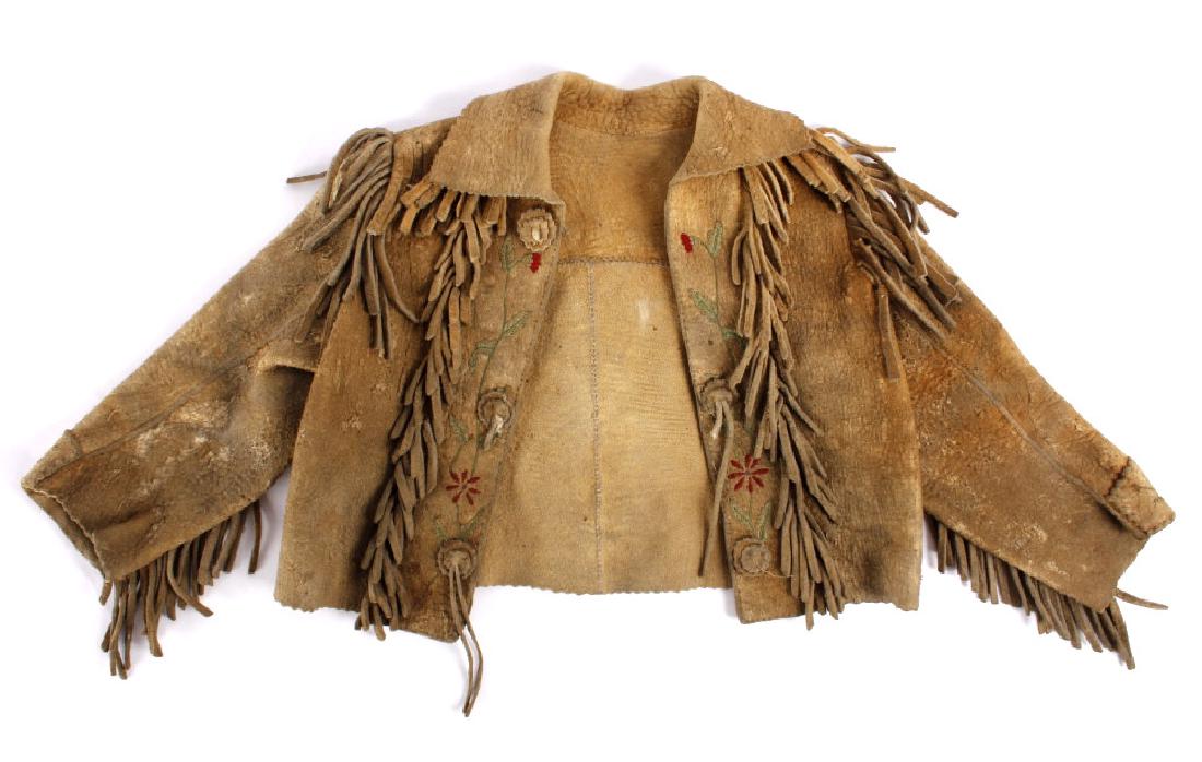 Northern Plains Childrens Floral Hide Scout Jacket: This item is a Northern Plains Native American Indian, children's scout jacket. The piece displays a tanned leather hide construction, with medium cut leather fringe adorning the seams of the jacket. 