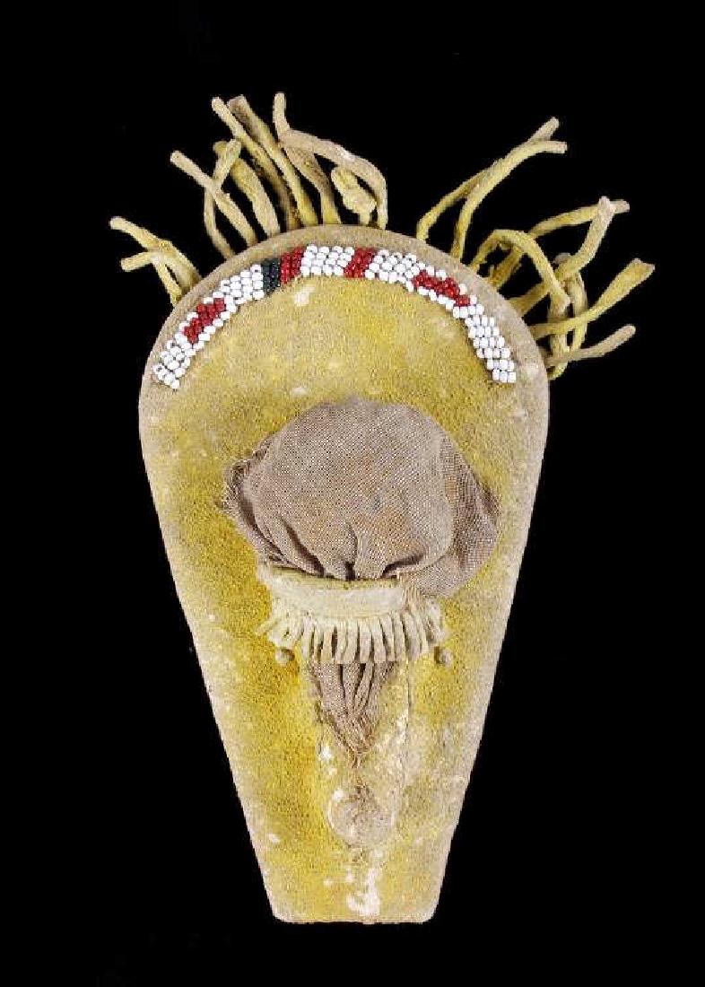 Apache Beaded Effigy Cradle Board 19th Century: This is an Apache Native American Indian beaded cradle board or papoose showing wonderful glass seed trade beadwork from the 19th Century. The early piece shows a wood frame construction with Indian t