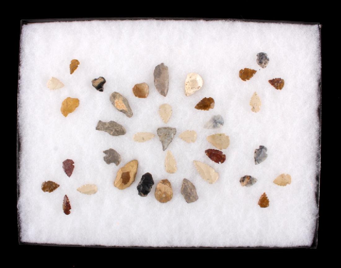 Native American Arrowhead Collection from Colorado: This is a collection of Native American Indian arrowhead artifacts from Colorado. There are 32 arrowheads and small scrapers in the collection that are displayed in a 12" x 16" case. The arrowheads ar