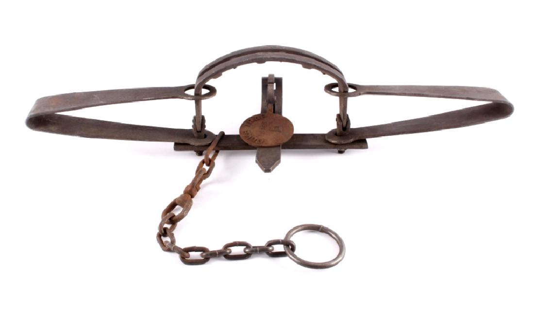 Duke #15 Double Spring Grizzly Bear Trap: This is a Duke #15 grizzly bear trap. The trap features a double spring action with offset teeth mounted jaws. The embossed pan is marked "Duke Trap #15 Bear D". The bear trap has the original drag ch