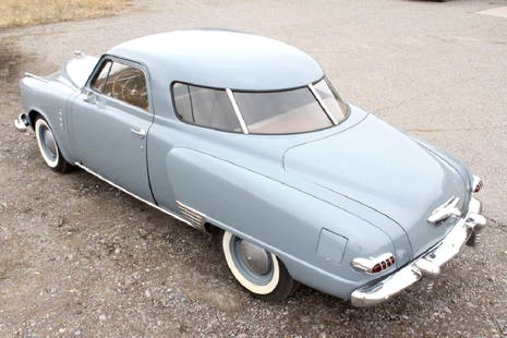 1947 Studebaker Commander Starlight Two-Door Coupe: The lot features a wonderful original 1947 Studebaker Commander/Champion Two-Door Starlight Coupe. The piece shows an older complete restoration including paint and is in good condition. The vehicle r