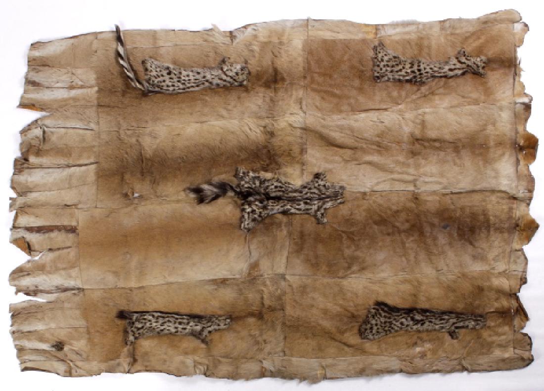 Antique Antelope & Civet Cat African Chiefs Robe: This lot offers you a very early tanned antelope hide, and civet cat, African Chiefs robe. The robe is cut into a rectangular shape, and has a civet cat hide in the center, and at each corner. Each en