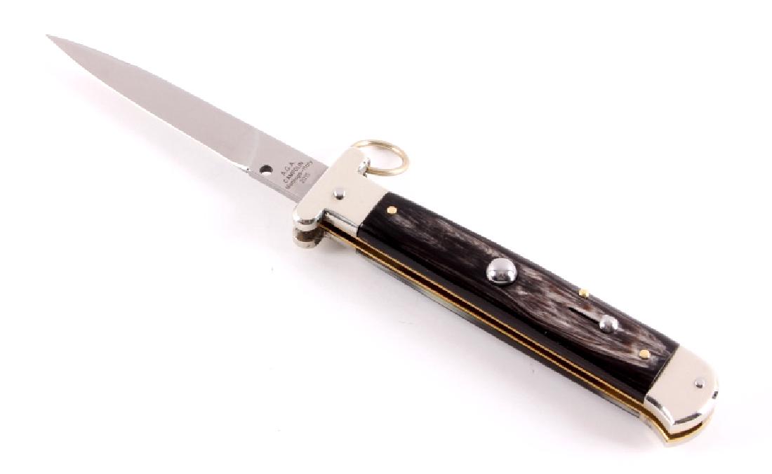 Campolin Ring Pull Buffalo Horn Switchblade Knife: This is an Italian ring pull switchblade stiletto knife made by A.G.A. Campolin in Maniago, Italy. The knife shows very high quality materials and craftsmanship and features beautiful buffalo horn gri
