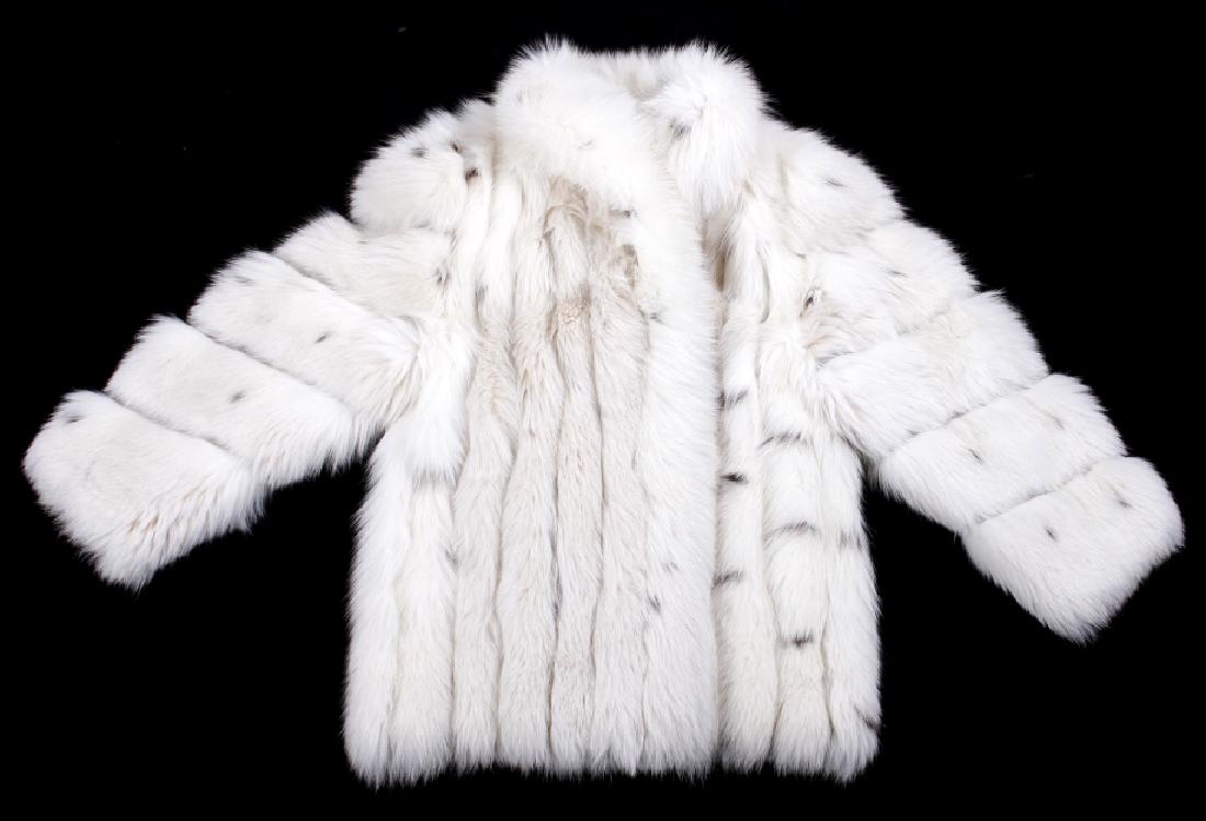 High End Giba-Noblia Arctic Fox Fur Coat: Available for your consideration is a high end Giba-Noblia arctic fox fur coat, from Beverly Hills, CA. The coat shows vibrant white coloring, with beautiful grey spotting. The coat has one interior s