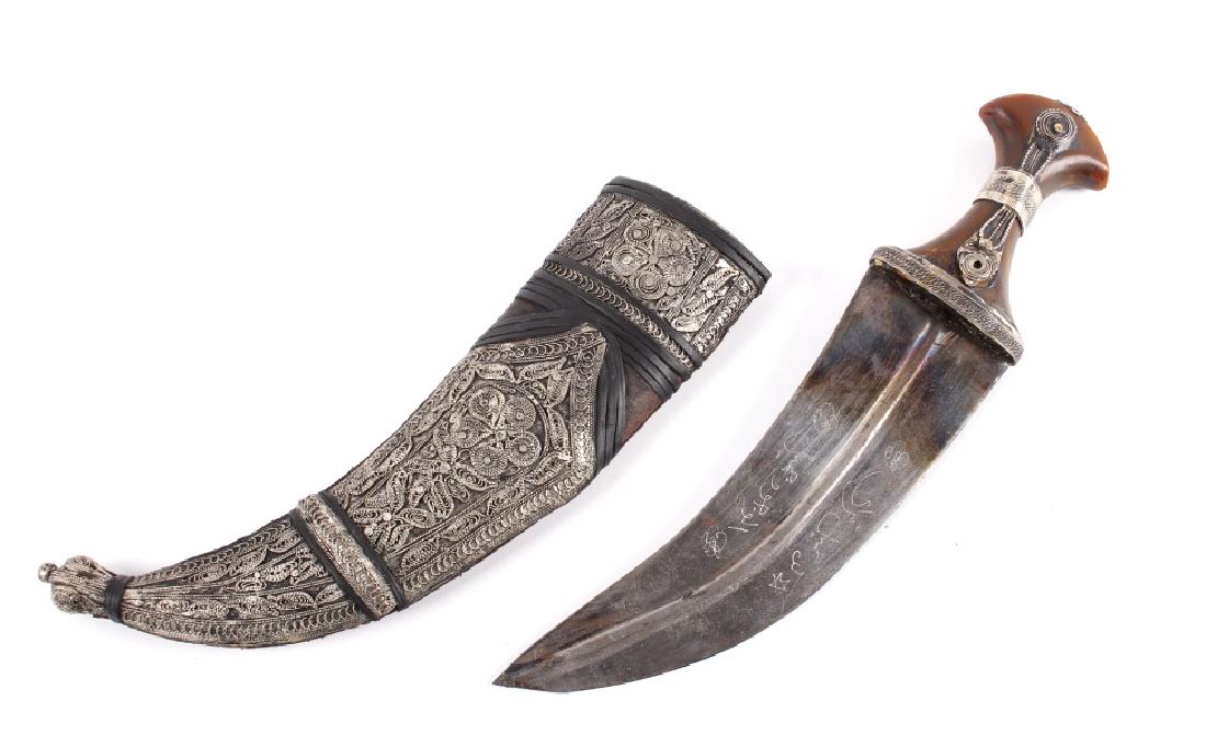 Islamic Ottoman Horn Handle Khanjar Dagger: Offered for bidding in this lot is an antique silver janbiya dagger, or Khanjar dagger. These daggers typically show a short curved double-edged blade, with a medial ridge, and a heavily decorated sca