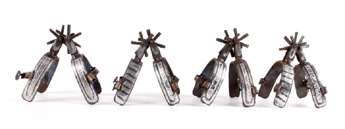 Antique Silver Mounted Mexican Charro Spurs: Offered in this lot is a set of four silver mounted, Mexican made, charro spurs. Each spur shows a six point rowels, with a striking linear pattern showing on the inside part of the U-arm, and a custo