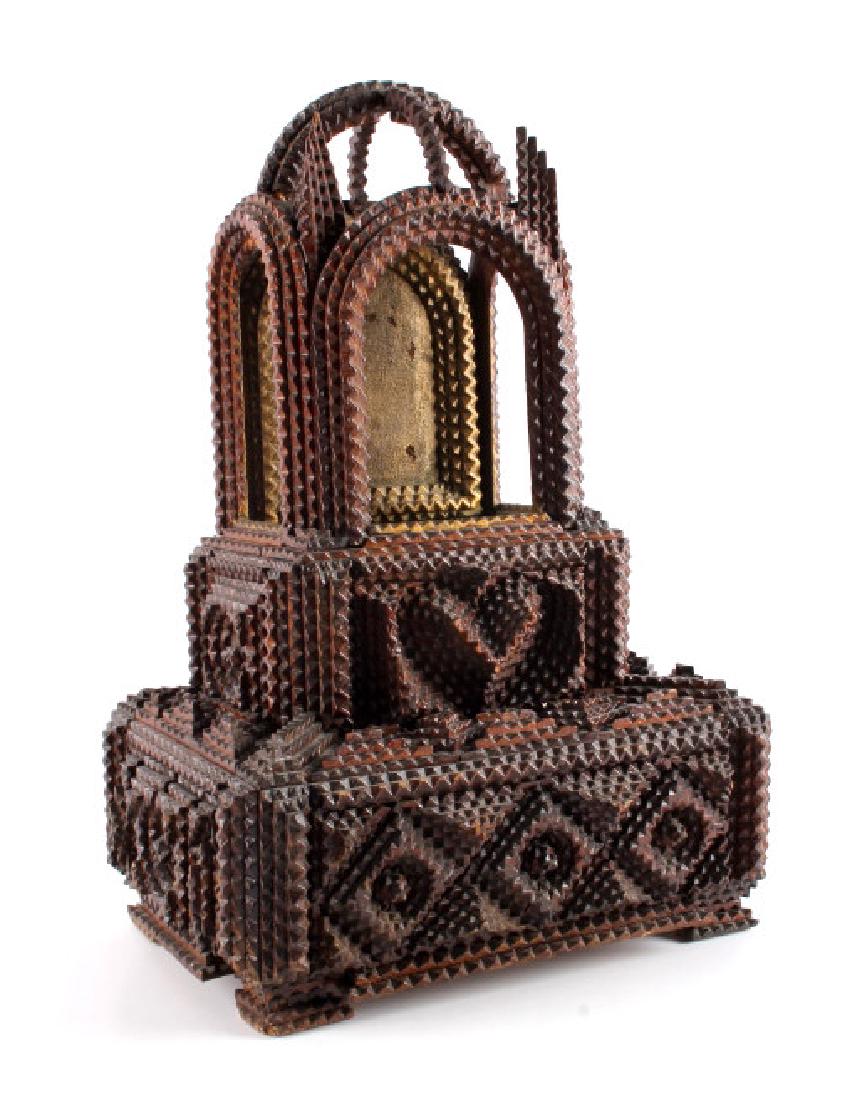 Hand Carved Wooden Tramp Folk Art Box: This is a hand carved wooden tramp folk art box. The piece shows a wonderful design composed of individual, hand carved pieces. The top has fantastic arches that contribute significantly to the wonder