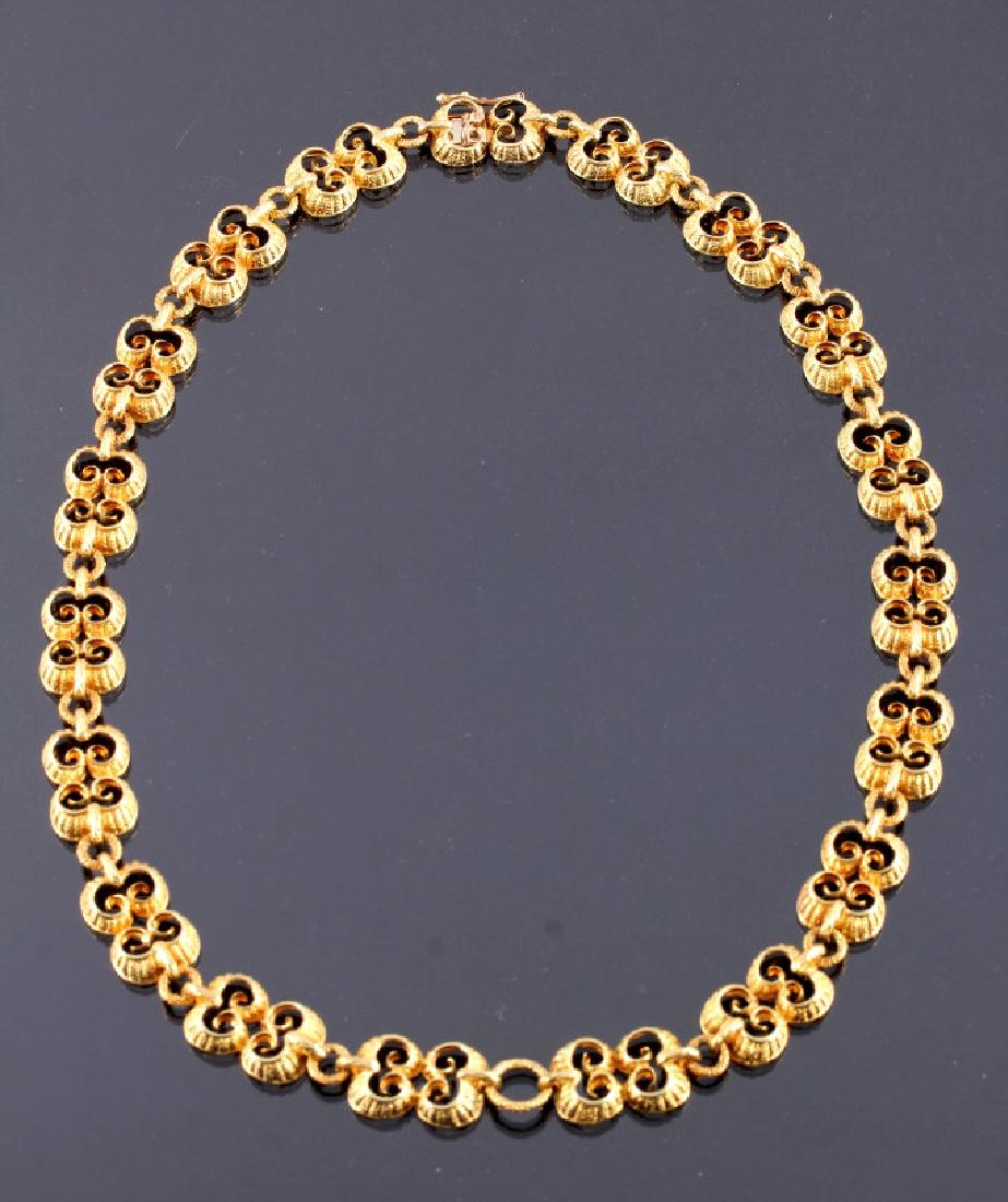 Exquisite Antique 18K Gold Necklace: This is an exquisite antique 18K yellow gold necklace. The necklace features 19 fancy links joined by gold rings. Each link displays a unique, bright gold ribbon design with a lovely contoured finish.