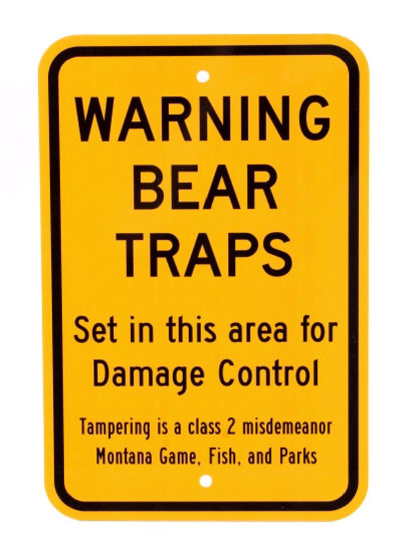 Montana Game, Fish, & Parks Bear Trap Sign: This lot features a bear trap sign. This sign was used to designate an area that had bear traps set. The sign was utilized by the Montana Game, Fish, and Parks to warn people that traps were set in th