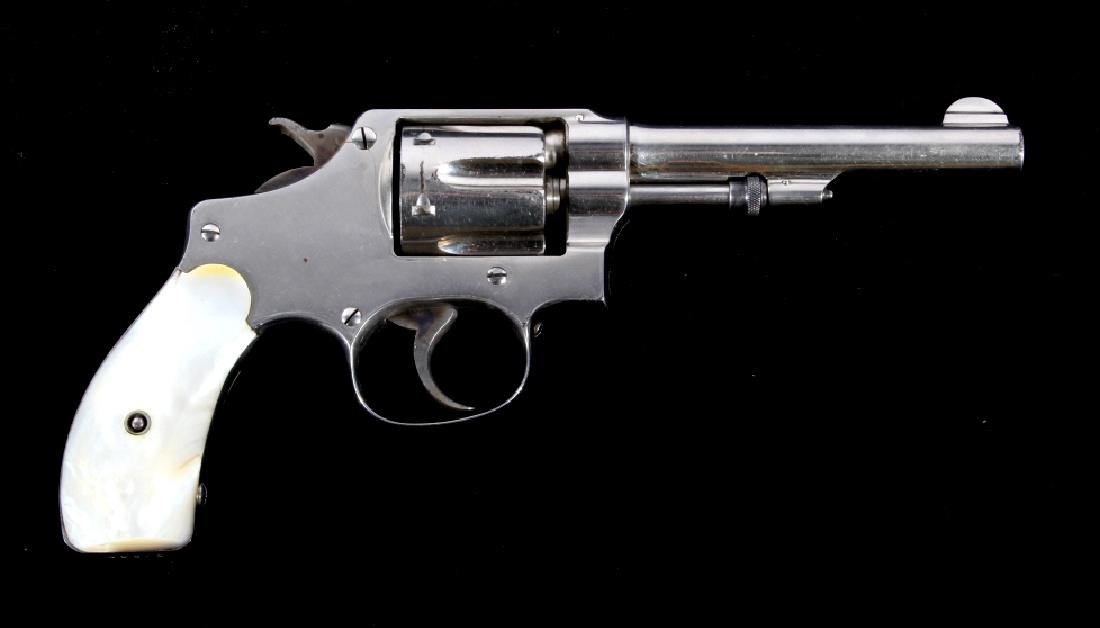 S&W Hand Ejector 1903 1st Model 32 Long Revolver: This lot features a great example of a Smith & Wesson Hand Ejector 1903 Model 1st Change .32 S&W Long Revolver. The revolver features a 4 1/4" barrel, nickel finish, 6 shot cylinder, pearl grips, case