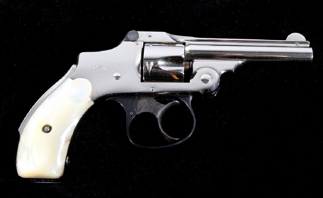 S&W .32 Safety Hammerless 2nd Mod. Nickel Revolver: Offered for sale is a Smith & Wesson .32 Safety Hammerless 2nd Model Nickel Revolver. The revolver features a 3" barrel, nickel finish, blue'd trigger guard, and a five shot cylinder. The Smith & Wess