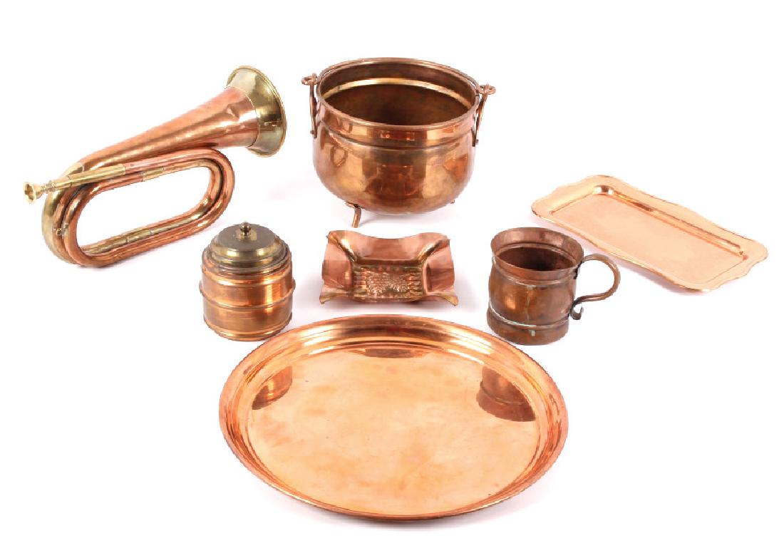 Copper Trumpet & Service Pieces Early to Modern: This lot consists of a collection of 7 pieces of antique and vintage copper items. The items include a bugle, humidor, mug, small kettle, small round tray, small rectangular tray and an ashtray. Of th
