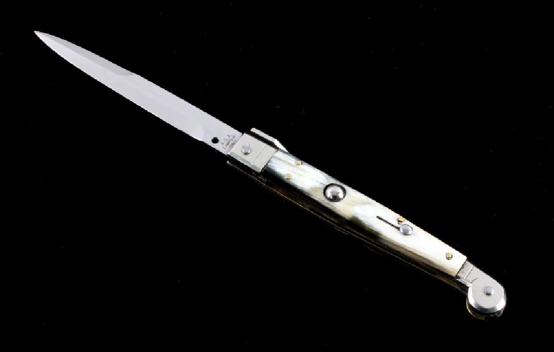 Campolin Buffalo Horn Picklock Switchblade Knife: This is an Italian made Campolin picklock switchblade stiletto knife. The knife features a hardened steel bayonet style blade with genuine buffalo horn grips. The knife shows fine quality craftsmanshi