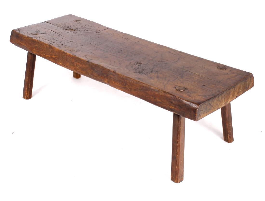 Primitive Hog Bench Coffee Table c. 1850's: This lot offers you an antique, primitive hog bench coffee table. Traditionally, the hog bench is used for pig slaughter, and preparation. This table follows the same heavy duty construction and rusti