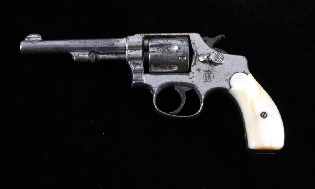 Smith & Wesson 1903 2nd Change .32 DA Revolver: This is a Smith & Wesson Model 1903 2nd Change Hand Ejector double action revolver chambered in the .32 S&W Long caliber. The revolver features a bright nickel finished frame, 4.25" barrel and 6-shot