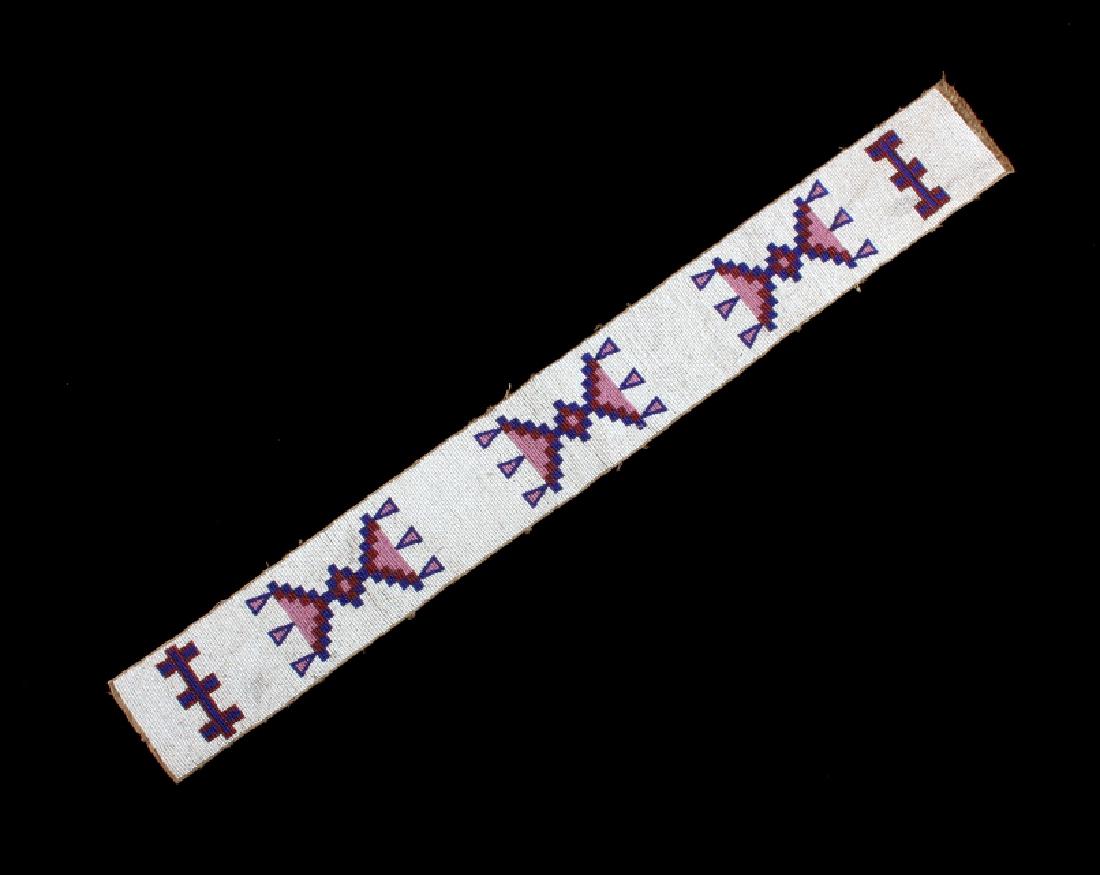 Sioux Native American Beaded Blanket Strip c.1890: This is a Sioux Native American Indian beaded blanket strip from circa 1890. The piece is made on heavy canvas with a wonderfully beaded design on the front. The beadwork consists of five geometric pa