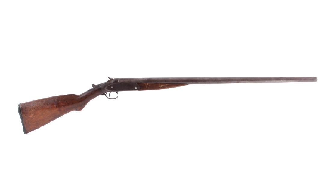 Sears New Long Range Winner 12ga. Shotgun: This is a Sears Roebuck & Company New Long Range Winner single shot shotgun chambered for the 12 gauge. The shotgun has a blued steel 30" barrel with solid walnut hardwood stocks. The left side of the