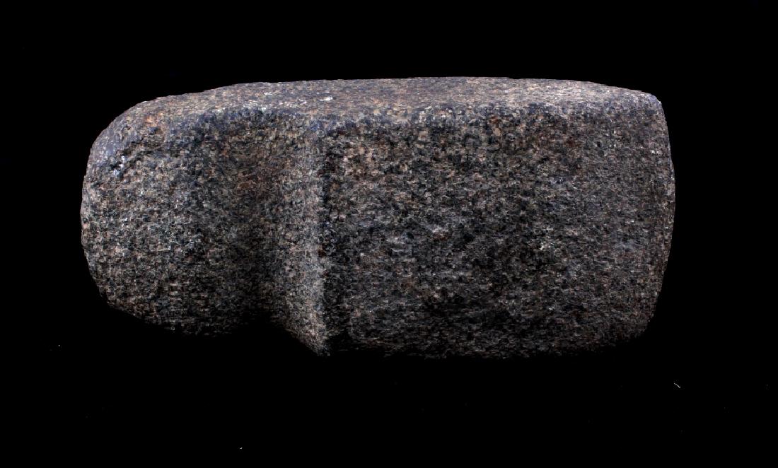 Archaic Period Three Quarter Grooved Axe Head: This lot provides you the opportunity to bid on an axe head believed to date to the Archaic Period (3,000-10,000 years ago). The granitic stone axe head shows a three quarter grooved pattern for hafti