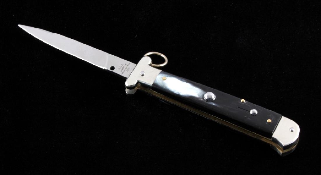 Campolin Ring Pull Buffalo Horn Switchblade Knife: This is an Italian ring pull switchblade stiletto knife made by A.G.A. Campolin in Maniago, Italy. The knife shows very high quality materials and craftsmanship and features beautiful buffalo horn gri