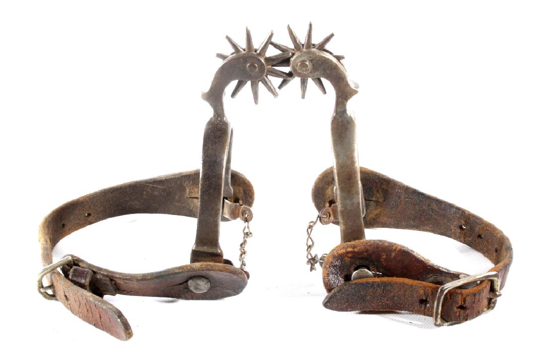 August Buermann Drop Shank Ladies Spurs: You are bidding on a August Buermann Drop Shank Ladies Spurs. The spurs feature a drop shank design, 1 1/2" roundels, and leather binding. The spurs are in good condition, with wear from age and use.
