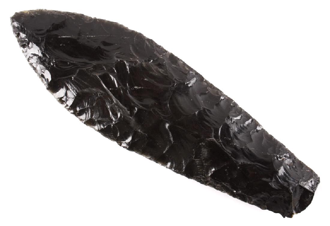 Native American Obsidian Projectile Point: Offered to you in this lot is an ancient Native American Indian projectile spear point. The point is knapped of rich black obsidian, with semi-translucent grey showing up around the thin edges, when h