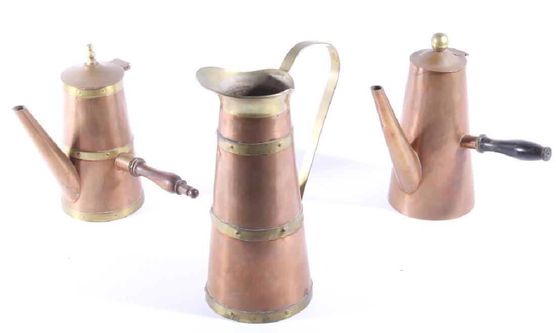 Tooled Copper & Brass Tea Kettles & Pitcher: Offered for sale is a Collection of Tooled Copper and Brass Tea Kettle and Pitcher. The lot features three pieces all features handles and a tooled design. The pieces all show good condition, with few