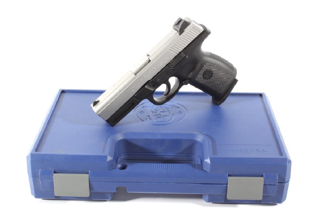 Smith & Wesson SW40VE .40S&W Semi-Auto Pistol: This lot features a Smith & Wesson SW40VE .40 S&W Semi-Auto Pistol. The pistol features 4" barrel, 14 round magazine, original case, polymer lower frame, and stainless slide. This pistol is in good co